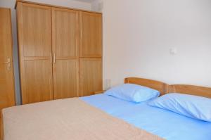 Postel nebo postele na pokoji v ubytování Apartmani Višnjić