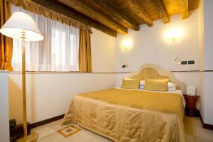 Postel nebo postele na pokoji v ubytování Ca' San Giorgio B&B