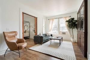 a living room with a couch and a chair at Stay Portland - The Étoile Suite - Nob Architecture & Boutiques in Portland
