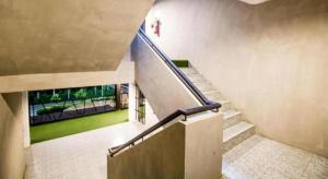 a staircase in a building with a stair case at B2 Lanna Boutique & Budget Hotel in Chiang Mai