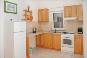Kuchyň nebo kuchyňský kout v ubytování Apartmani Višnjić