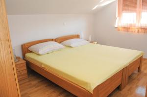 Postel nebo postele na pokoji v ubytování Apartmani Višnjić