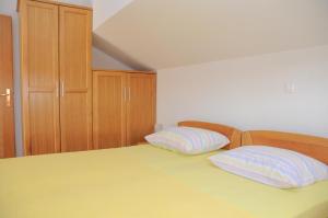 Postel nebo postele na pokoji v ubytování Apartmani Višnjić