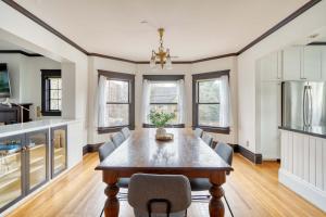 a kitchen and dining room with a table and chairs at 1910 Historic Jessie Morehead House - 98 WalkScore in Portland