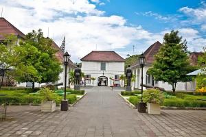 a street in a town with houses and trees at Lafayette Boutique Hotel in Yogyakarta