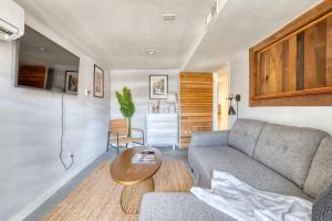 a living room with a couch and a table at Unique Portland Home in Pearl District Sleeps 4 in Portland