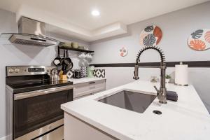 a kitchen with a sink and a stove at Unique Portland Home in Pearl District Sleeps 4 in Portland +17 photos
