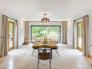 a dining room with a long table and chairs at Lime Tree House - Uk49477 in Bulmer +26 photos
