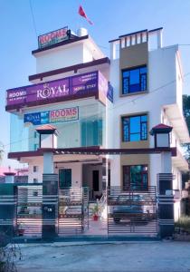 a building with a car parked in front of it at The Royal Scout Homestay in Changar Talai