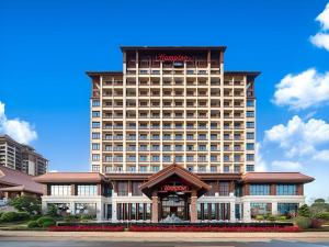 a rendering of a hotel with a large building at Hampton by Hilton Nanhai Haikou in Haikou