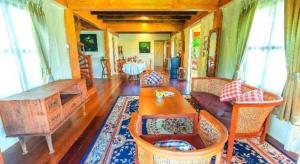 a living room with a couch and a table at Burann Bangtanode in Ban Bang Tanot +58 photos