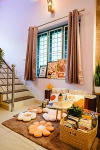 a living room with a couch and a rug at Guestland Homestay in Cochin