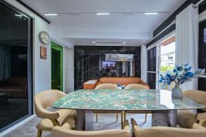 a dining room with a table and chairs at DreamHouse in Ban Bang Khu