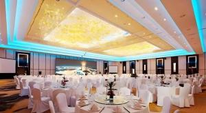 a banquet hall with white tables and white chairs at New Century Hangzhou Grand Hotel in Xiaoshan +255 photos