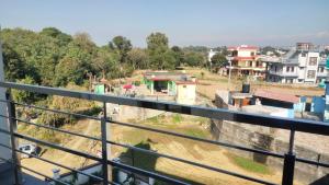 a view of a city from a balcony at The Royal Scout Homestay in Changar Talai