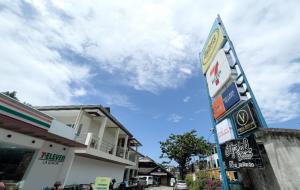 a sign for a gas station in front of a building at Sebay Surf Central San Juan La Union in San Juan