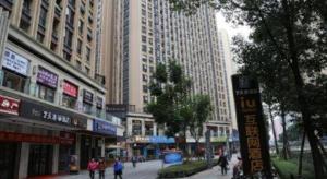 a city street with tall buildings and people walking at IU Hotel Chengdu High-Tech Zone Longhu Times Street in Xipu