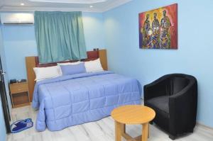 Postel nebo postele na pokoji v ubytování PnK Inn