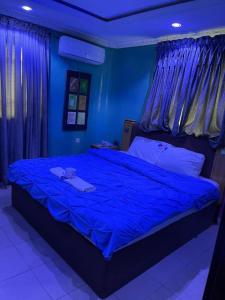 Postel nebo postele na pokoji v ubytování PnK Inn