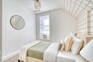 a white bedroom with a bed and a window at Stay Portland - Haven by the Hill - Downtown & OHSU Proximity! in Marquam Hill +35 photos