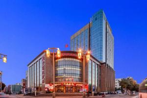 a tall building with lights on top of it at Datong Tiangui International Hotel in Datong