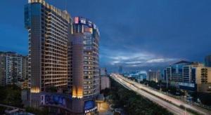a tall building in a city with a highway at Nanning Prince Hotel in Nanning