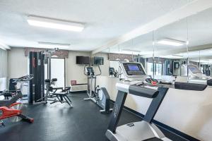 a gym with treadmills and machines in a room at Quality Inn Winchester in Winchester