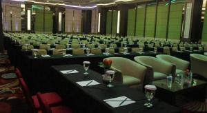 a large conference room with long tables and chairs at G'Sign Hotel Banjarmasin in Sungai Lutus +149 photos