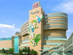 a building with a sign on the side of it at Diamond Sweet Hotel in Bangkok