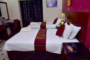 Voodi või voodid majutusasutuse Al Bahjah Hotel toas