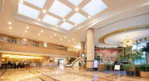 a large building with a lobby with a staircase at Grand Metropark Hotel Nanjing in Nanjing +240 photos