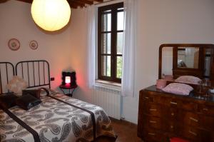 Postel nebo postele na pokoji v ubytování Agriturismo Sant'Alfredo + 37 fotografií