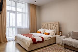 Postel nebo postele na pokoji v ubytování Возле EXPO, есть все настольные игры + 47 fotografií