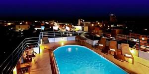 a balcony with a swimming pool on top of a building at Hua Hin Loft Managed by Loft Group in Hua Hin
