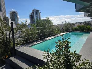 a swimming pool on top of a building at Thirty Three Boutique -Adults Only By K Hotels in St. Julianʼs