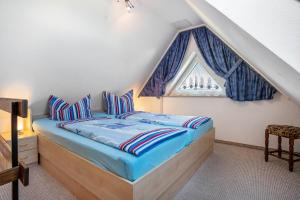 Una cama o camas en una habitación de Haus Arvert