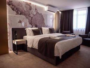 Postel nebo postele na pokoji v ubytování Aslan Gold Hotel