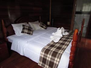 Postel nebo postele na pokoji v ubytování Ecolodge Don Felix