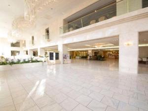 a large lobby with a large white tile floor at Gifu Grand Hotel in Gifu