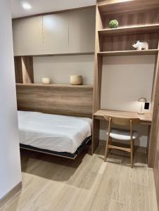 a bedroom with a bunk bed and a desk at Margot Apartments By MrW in Guadalajara