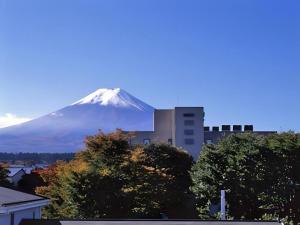 a view of a snow covered mountain in the distance at Fujino Kinjo in Shimo-yoshida