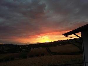 The sunrise or sunset as seen from a panziókat or nearby
