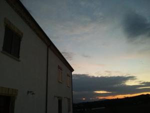 The sunrise or sunset as seen from a panziókat or nearby