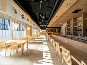 a dining area with tables and chairs in a restaurant at New Biwako Hotel in Zeze-Awazumachi