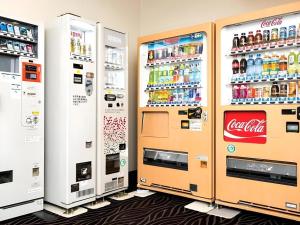 a row of cocacola machines in a store at New Biwako Hotel in Zeze-Awazumachi