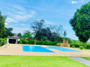 a swimming pool in the middle of a yard at The1 Mangosteen Harmony Retreat - Khaolak in Khao Lak +16 photos