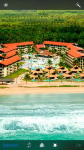 an aerial view of a resort on the beach at Marulhos Resort Muro Alto Studio in Porto De Galinhas