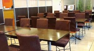 a row of tables and chairs in a room at AI HOTEL OYAMA in Oyama