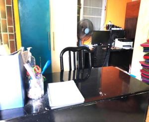 an office with a desk with a computer on it at OYO 90462 Padang Besar Green Inn in Padang Besar +19 photos