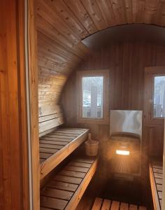 a wooden cabin with two bunk beds in it at Chalet Sainte Anne in Condamine-Châtelard